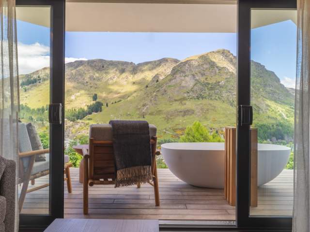 A landscape image of Coronet Ridge Resort Shotover View Room on a sunny day