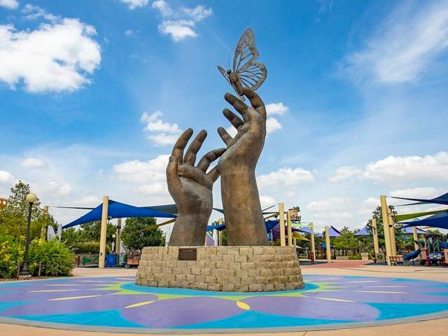 Sculpture of hands with butterfly
