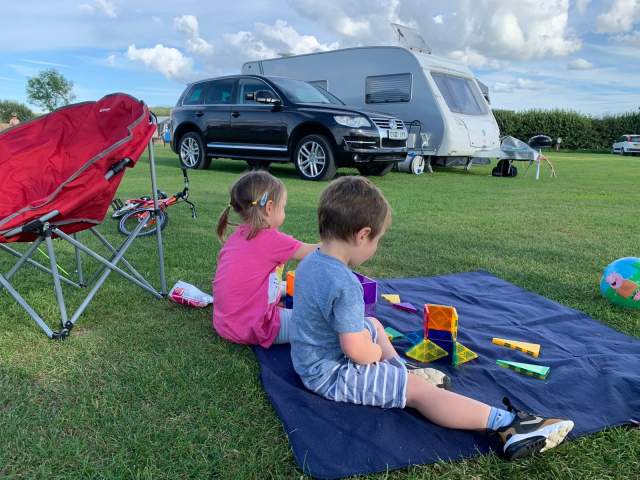 Two children at a camp site
