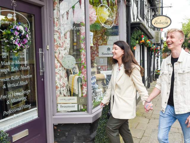 couple enter shop High Street