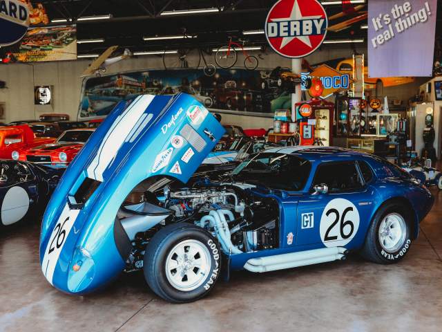 Classic cars in large car garage.