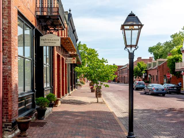 The road, sidewalks, and buildings are all made of brick in Historic Main Street in St. Charles, MO