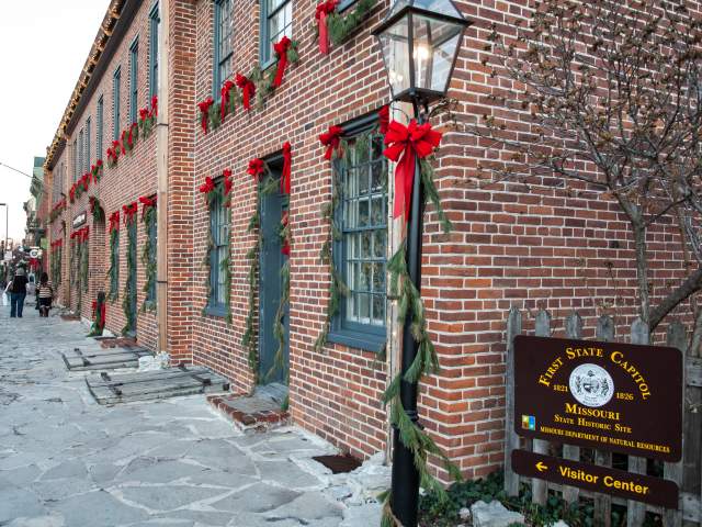 Exterior of St Charles visitor center decorated for Christmas