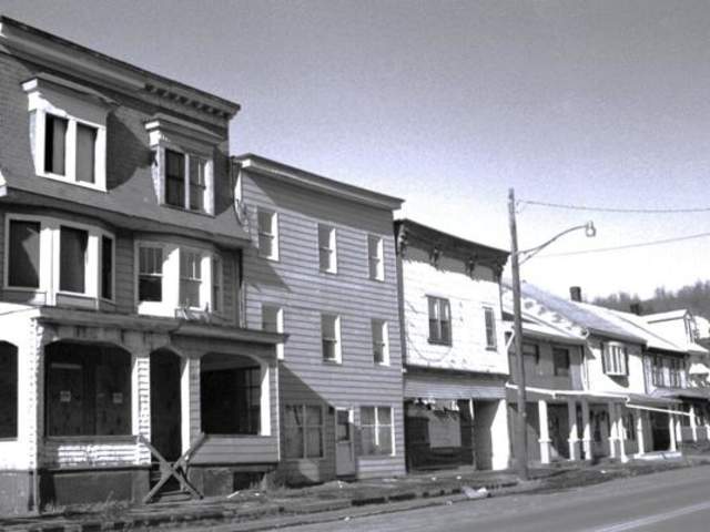 Homes in Centralia are vacated, boarded and awaiting demolition circa 1980.