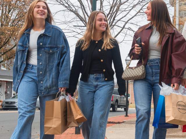 Girls Shopping in Downtown Selinsgrove - Three Girls Walking down market street in Selinsgrove PA with shopping bags in hand and smiles on their faces.