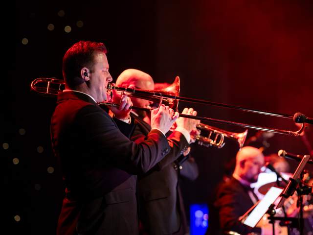 A live band playing brass instruments