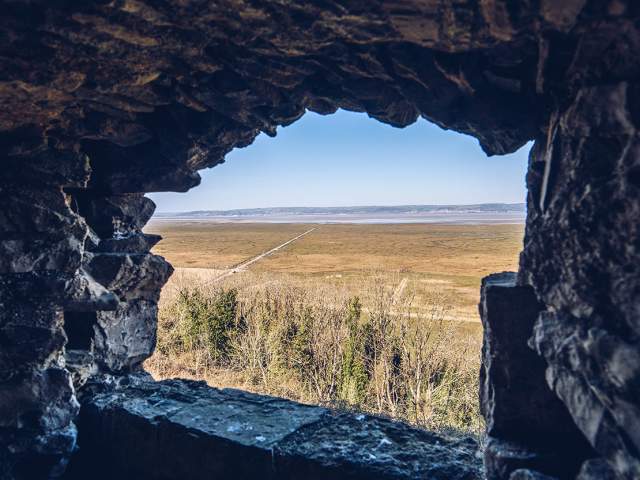 View of Loughor Estuary through a stone window.
