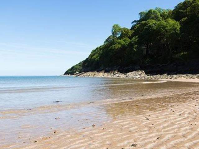 Tide coming in on oxwich bay beach