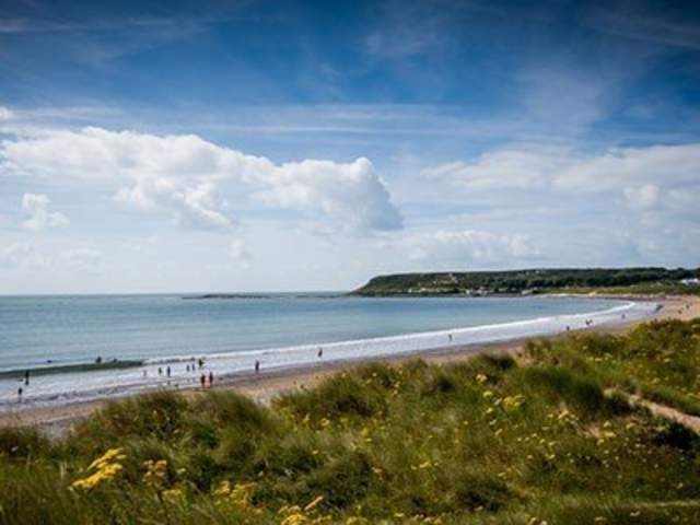 landscape photo of the sweep of Port Eynon Bay