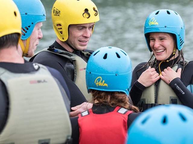 A group of people taking part in a coasteering session with Gower Activity Centres