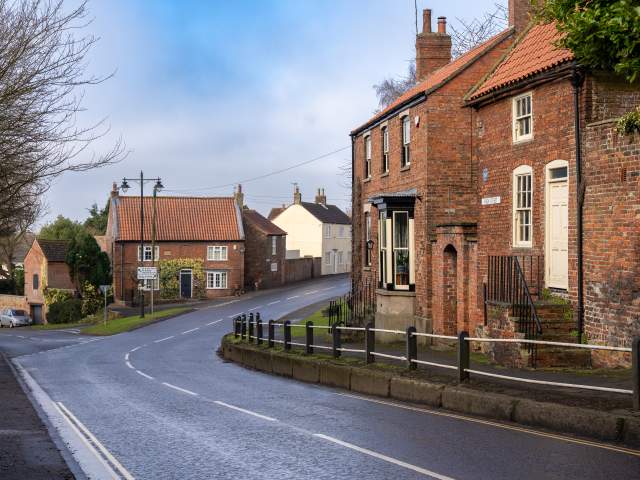 A quiet street in Caistor with houses and road going through the centre