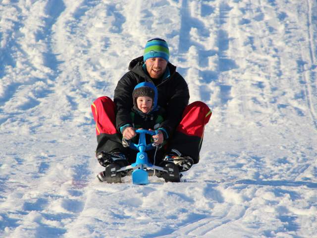 Father and son sledging at Sandrip in Kristiansand