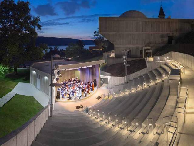A band plays on the stage of the Hudson River Museum Amphitheater.