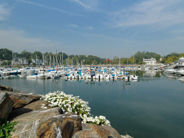 Sailboats are docked on the water in Rye.