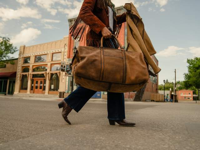 Lady with bags, ready to travel.