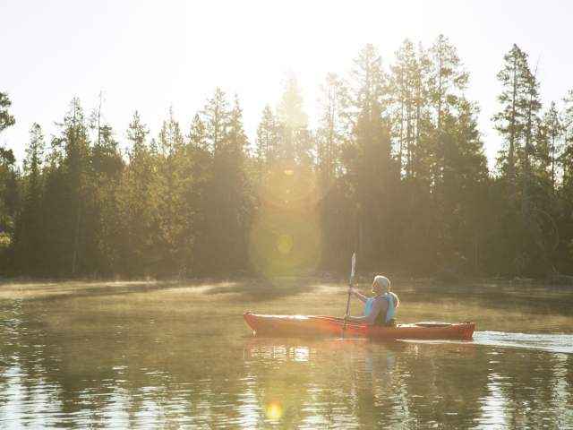 Kayaker paddling on Jackson Lake