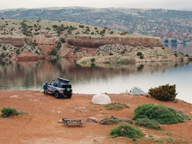 Camping Wyoming's wide open spaces on the edge of a reservoir.