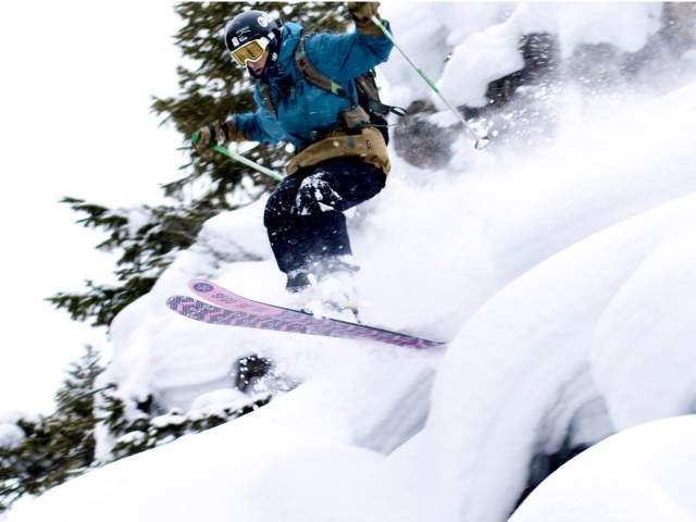 Skier jumping on the slopes.