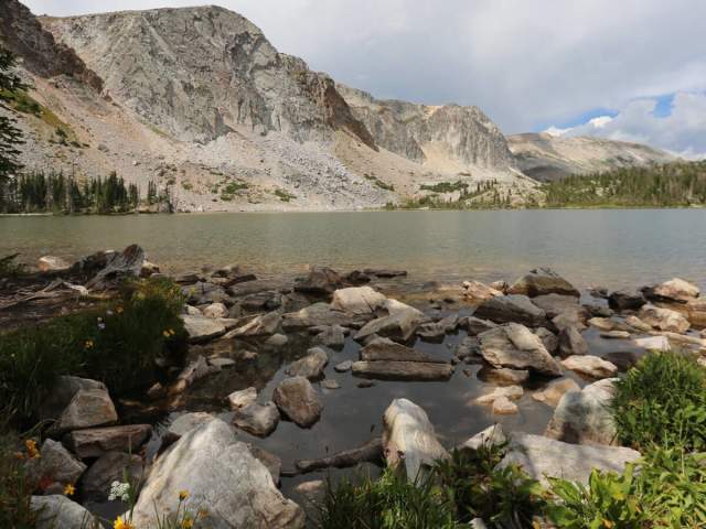 Snowy Range's Lake Marie surrounded by pine trees and rugged peaks in Albany County, Wyoming
