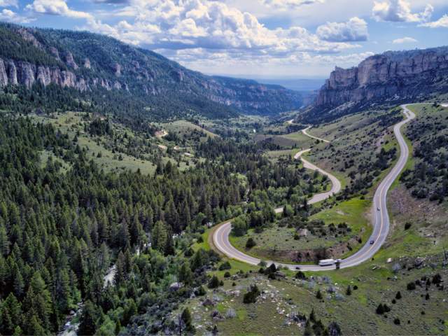 a switchback road winding up the side of a canyon