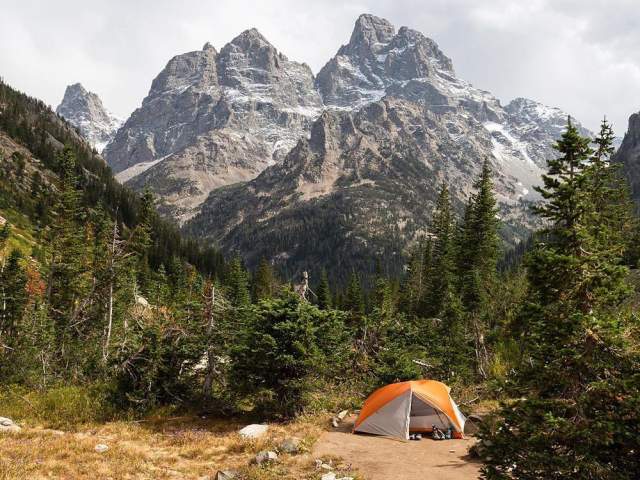 backpacking setup in front of the Teton mountain range in Wyoming 