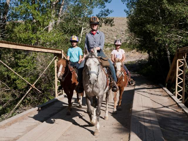 Horseback riding at a dude ranch.
