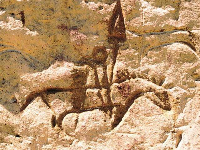 Etchings in rock at White Mountain Petroglyphs in Wyoming, a free activity 
