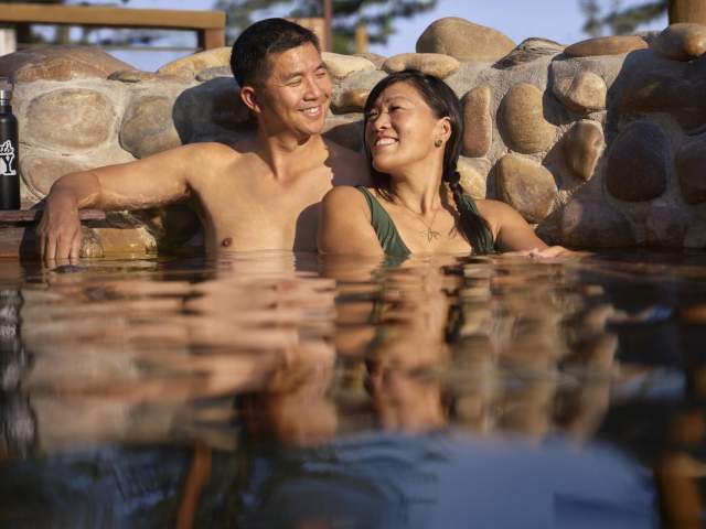 Couple soaking in the hot springs pool in Saratoga.