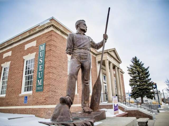 A statue stands before the Sweetwater Museum in Rock Springs, a popular things to do.