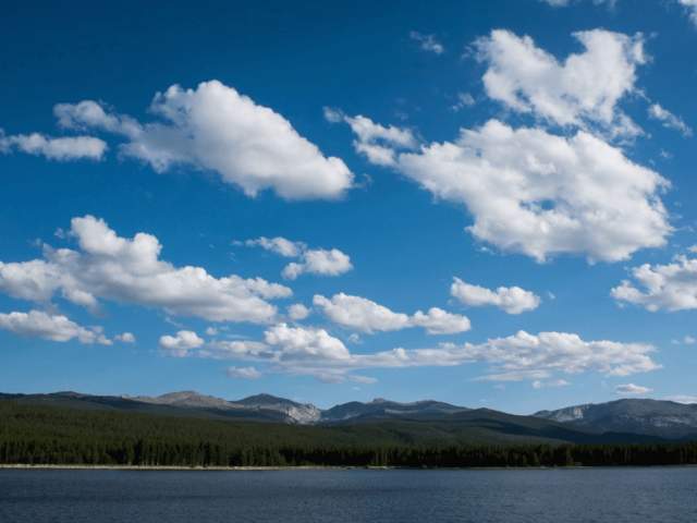 A lake in Wyoming with the mountains towering behind it.