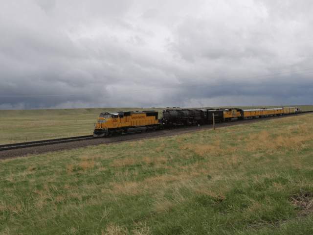 A Union Pacific locomotive traveling via rail in Wyoming.