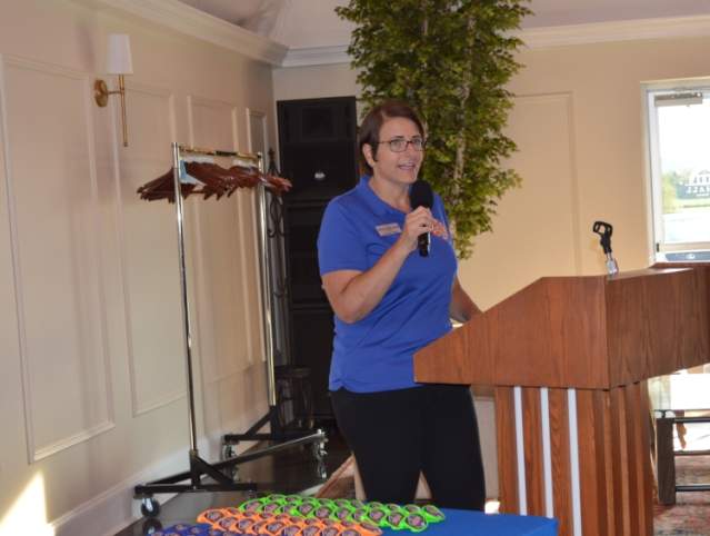 Ann Marie speaking at a podium