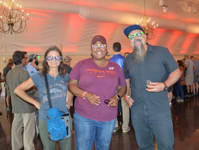 3 people standing together posing for a picture