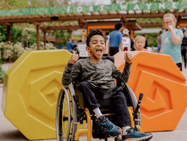 Boy in wheelchair enjoying the zoo
