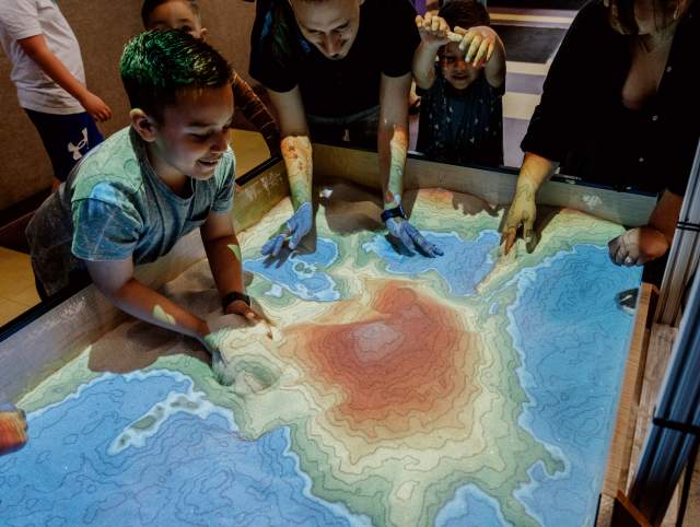 Boy doing a science experiment at Science Central
