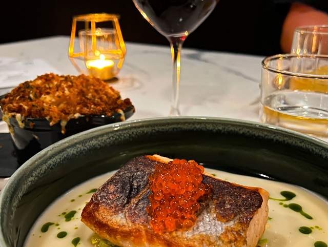 A dinner at Dana's in Fort Wayne. Salmon, baked mac and cheese, and red wine.