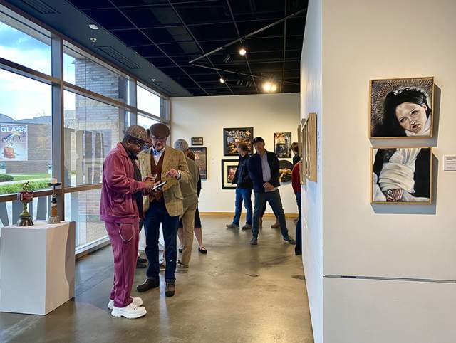 Photo of people looking at art at ARTLINK