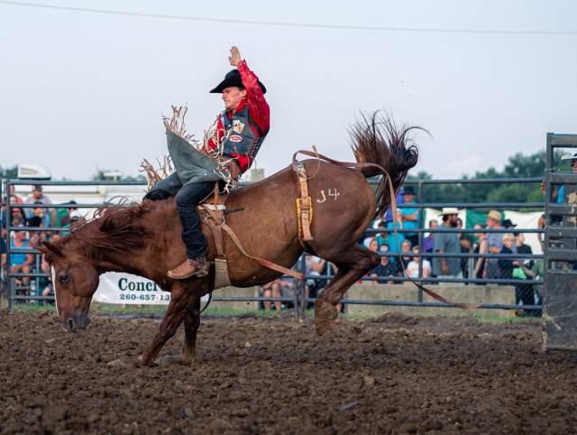 Bronco rider at Harlan Days rodeo. Copyright Kevin Mullett. Used with permission.