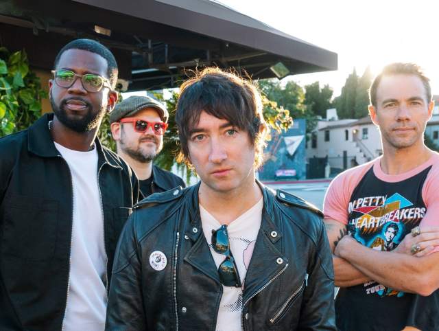 The Plain White T's posing for a photo as a group
