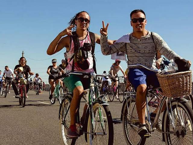 Group of people riding bikes / Event poster with details.