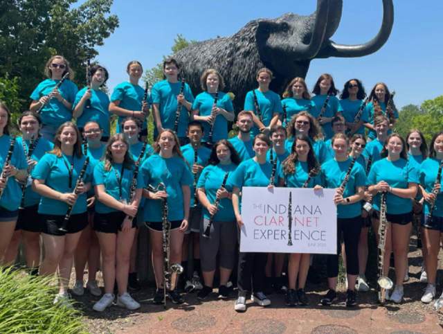 gaggle of clarinetists in front of mastodon statue