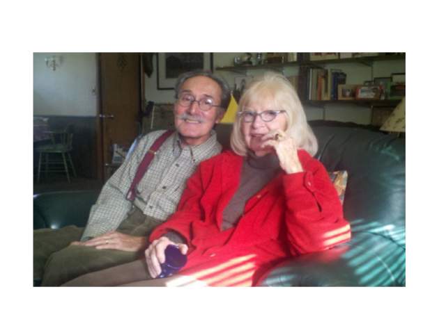 Old couple sitting on couch