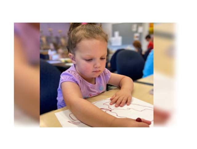 Little girl from grades K–3, creates a wonderful drawing