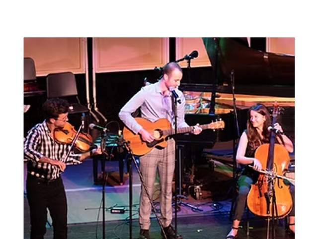 The Super Group preparing for their show at the Columbia Club