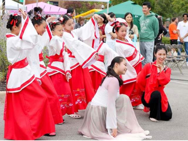 Chinese and Mexican dance performances during 2025 Welcoming Week festivities. Attendees hugging during networking portion of 2025 Welcoming Fort Wayne Awards.