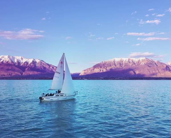 Sailing Boat on Utah Lake with Mountains in Background