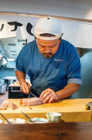 Orlando - Floridas Table - Juju - Chef Lin Slicing Fish