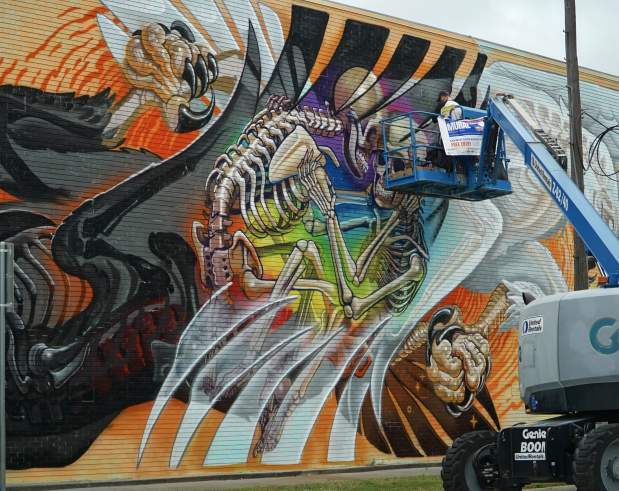 a mural depicting two eagles in a courtship ritual showing their skeletons