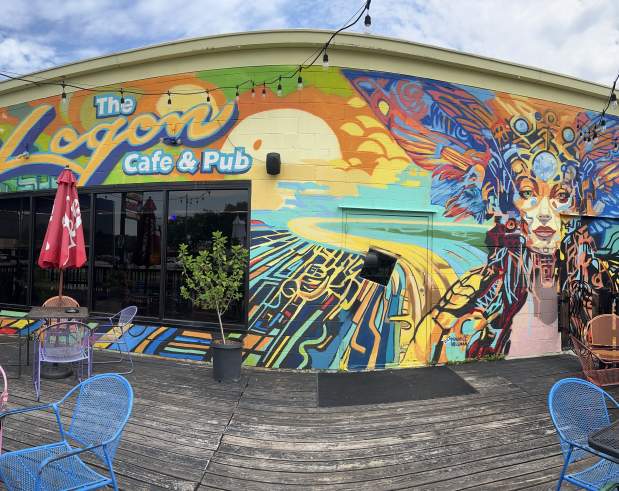 a mural who portrays a girl who has fairy aspects