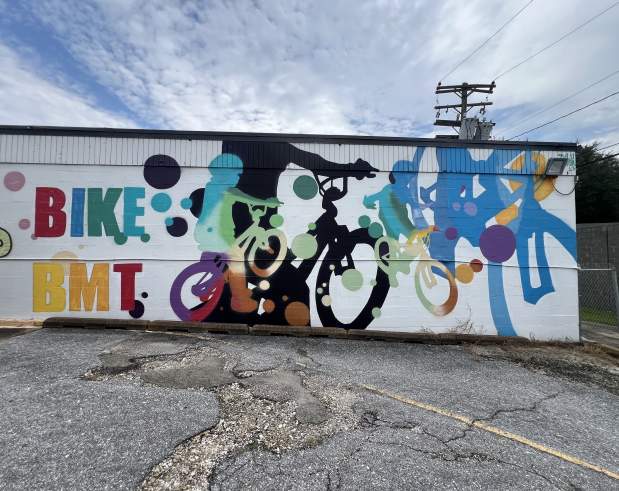 a mural showing children on bicycles